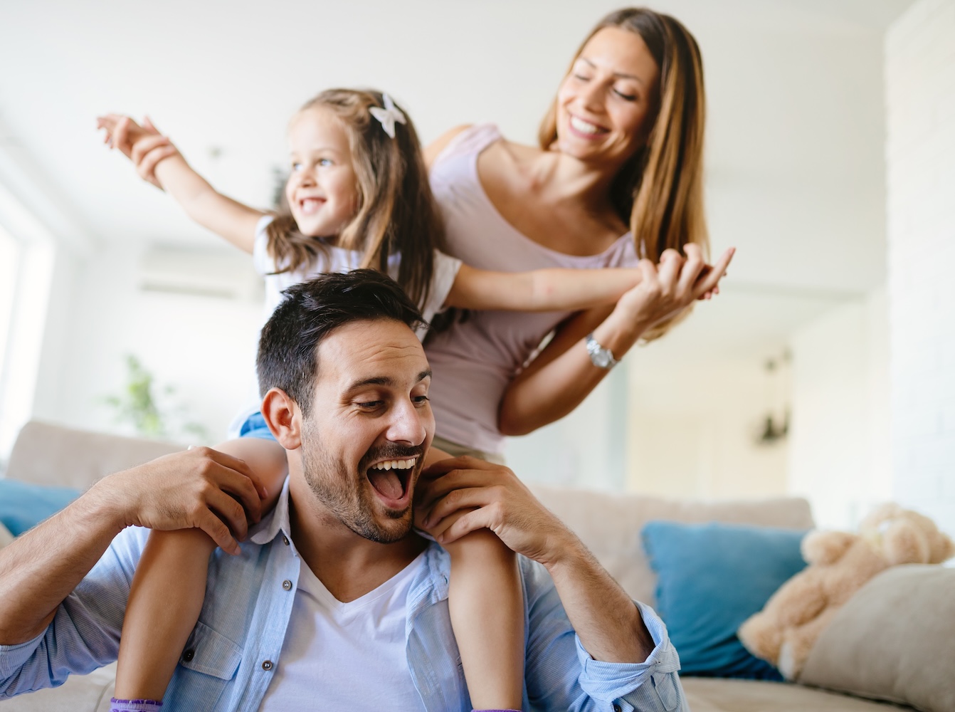 Happy family having fun times at home together