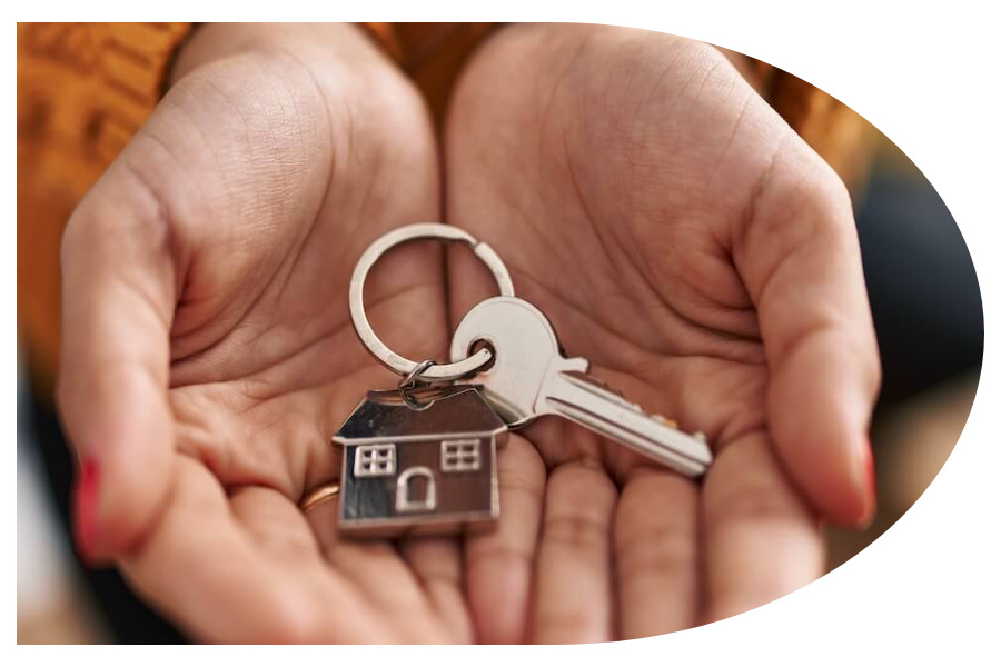 House keys being held in the palm between hands
